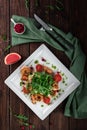 King prawn salad with tomatoes, arugula and grapefruit on a wooden table in a restaurant, top view Royalty Free Stock Photo