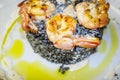 King prawns grilled with a side of black rice Royalty Free Stock Photo
