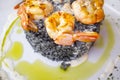 King prawns grilled with a side of black rice Royalty Free Stock Photo