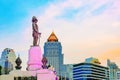 King Rama VI statue at and hotels in the background