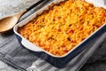 King Ranch Casserole is lined with corn tortillas, then layered with sauce and topped with cheese close-up in a baking dish. Royalty Free Stock Photo