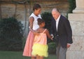 King of Spain jokes with Michelle Obama and her daughter Sasha during a meeting in the island of Majorca