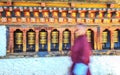 Kingdom of Bhutan, Young monk at Trongsa Dzong prayer mills