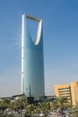 Kingdom Center tower or Burj Al Mamlaka glows a blue color  again blue sky Royalty Free Stock Photo