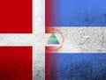 The Kingdom of Denmark National flag with The Republic of Nicaragua National flag. Grunge Background