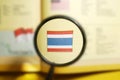 Thailand Flag under magnifying glass with selective focus.