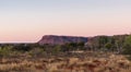 Kings Canyon cliff at sunset time. Panorama picture. Blue and pink sky. Watarrka national park, Northern Territory NT, Australia Royalty Free Stock Photo