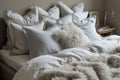 kingsize bed with a range of down pillows and fur blanket