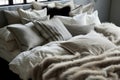 kingsize bed with a range of down pillows and fur blanket Royalty Free Stock Photo