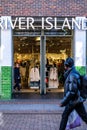 People Walking Past A Branch Of A River Island Fashion Shop Royalty Free Stock Photo