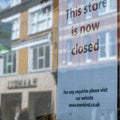 Shop Window Business Closed Sign In A Shop Or Store  With A Reflection Of A High Street Royalty Free Stock Photo