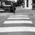 Businessman Alone Walking Past A Pedestrian Or Zebra Road Crossing