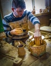 Kinik, Bilecik / Turkey - September 08 2019: Man`s hands making ceramic pot on the pottery wheel. Craftsman creating pottery