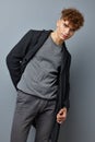 kinky guy posing in a coat model isolated background