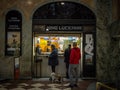 Kino Lucerna Cinema ticket booth with clients waiting to buy a ticket to watch some movies.