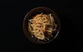 Kinpira burdock on a black background