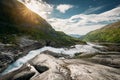 Kinsarvik, Hordaland, Norway. Water Stream Through Rocks In Hardangervidda Mountain Plateau. Sun Sunshine Above Rocky Royalty Free Stock Photo