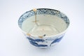 Kintsugi antique Japanese bowl restored with gold.