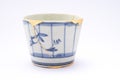 Kintsugi antique Japanese soba cup restored with gold. Royalty Free Stock Photo