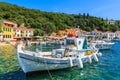 KIONI PORT, ITHACA ISLAND, GREECE - SEP 19, 2014: traditional Greek fishing boat in port of Kioni village. Colourful boats are