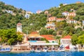 KIONI PORT, ITHACA ISLAND, GREECE - SEP 19, 2014: traditional greek houses in port of Fiskardo village. This town is most visited Royalty Free Stock Photo