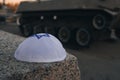 kippah cap in the Israeli flag style against background of a tracked tank. The concept of commemorating the victims of the