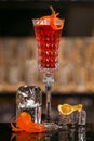 Kir Royal cocktail with orange slice and ice cubes Royalty Free Stock Photo