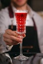 Kir Royal cocktail with orange slice and ice cubes Royalty Free Stock Photo