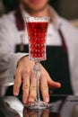 Kir Royal cocktail with orange slice and ice cubes Royalty Free Stock Photo