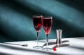 Kir Royale cocktail with black currant liqueur, prosecco wine and red cocktail cherry. Dark green background, hard light and Royalty Free Stock Photo