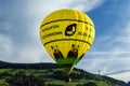 Kirchberg in Tirol, Tirol/Austria - September 26 2018: Bright yellow hot-air balloon with panda bears just taking off from the