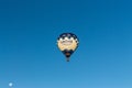 Kirchberg in Tirol, Tirol/Austria - September 27 2018: A Grohe branded hot-air balloon flying high up in the blue sky during an