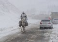 Kirghiz on a horse during a snow storm Royalty Free Stock Photo