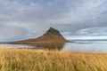 Kirkjufell in Iceland famous mountain reflecting in lake during stormy day Royalty Free Stock Photo