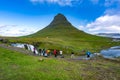 Kirkjufell, Iceland - Tourist crowds lined up to photograph the waterfall in front of the Kirkjufell Mountain