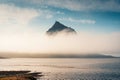 Kirkjufell mountain hidden in foggy over atlantic ocean in summer at Iceland Royalty Free Stock Photo