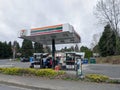 Kirkland, WA USA - circa April 2021: Angled view of a 7 Eleven gas station at the corner of a small intersection