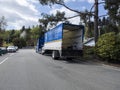 Kirkland, WA USA - circa April 2021: Angled view of a New World Van Lines moving truck in a residential neighborhood