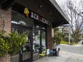 Kirkland, WA USA - circa April 2021: Street view of the entrance to a Ben and Jerry`s ice cream shop in downtown Kirkland