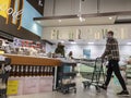 Kirkland, WA USA - circa April 2022: View of men and women shopping in the bakery department inside a Whole Foods grocery store Royalty Free Stock Photo