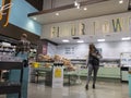 Kirkland, WA USA - circa April 2022: View of men and women shopping in the bakery department inside a Whole Foods grocery store Royalty Free Stock Photo