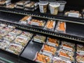 Kirkland, WA USA - circa February 2022: Angled view of prepackaged sushi varies inside a Whole Foods Market`s prepared food