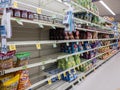 Kirkland, WA USA - circa January 2022: Angled view of food shortage in the snack aisle in a Safeway grocery store during heavy