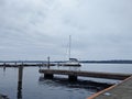 Kirkland WA USA circa July 2020: View of a single, white boat docked at the downtown Kirkland Marina on Lake Washington on an