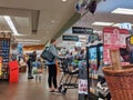 Shoppers lining up at checkout and express lane checkout to purchase groceries inside a QFC store Royalty Free Stock Photo