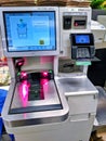 View of a self checkout counter in a QFC grocery store