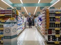 Kirkland, WA USA - circa October 2021: Woman browsing medicine and supplements in the pharmacy section of a Safeway grocery store