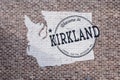 Welcome to Kirkland sign on the exterior brick wall of a building