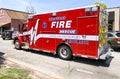 Kirkwood Ambulance awaits a patient outside a retail store Royalty Free Stock Photo