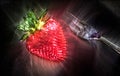 3D-Illustration Kirlian glow on strawberries with leaves on a plate in a glas bowl. Isolated on a white background